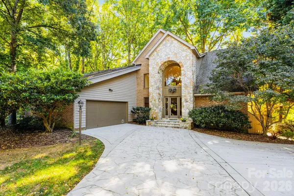 a view of a lake with boats and trees