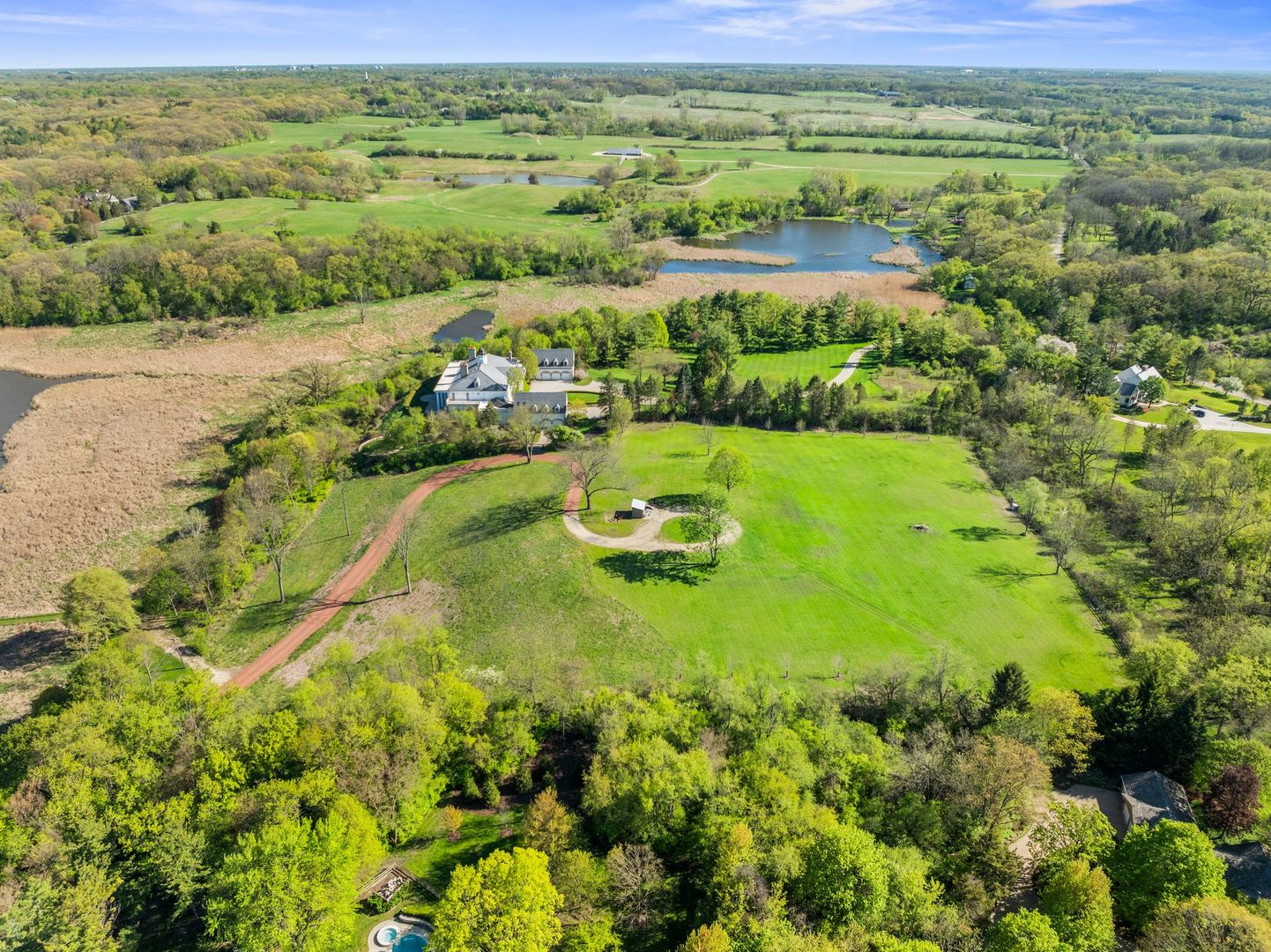 241 Otis Road Barrington Hills, IL 60010 - Photo 8 of 11 a view of a lake with a houses