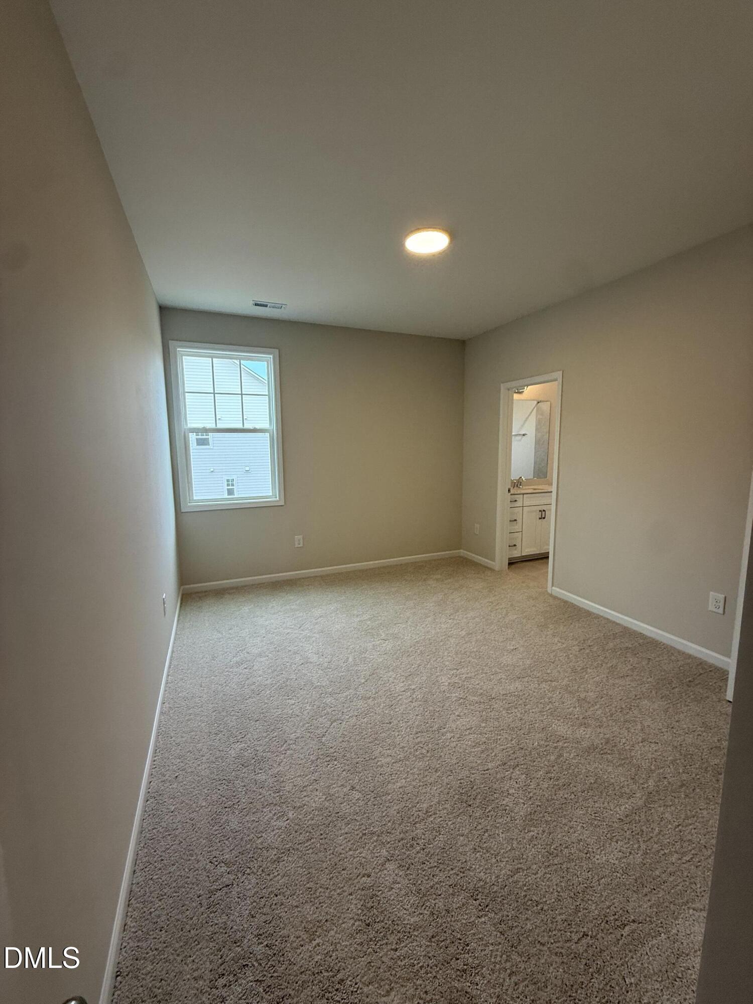 2437 Picual Way Apex, NC 27502 - Photo 23 of 31 an empty room with a window