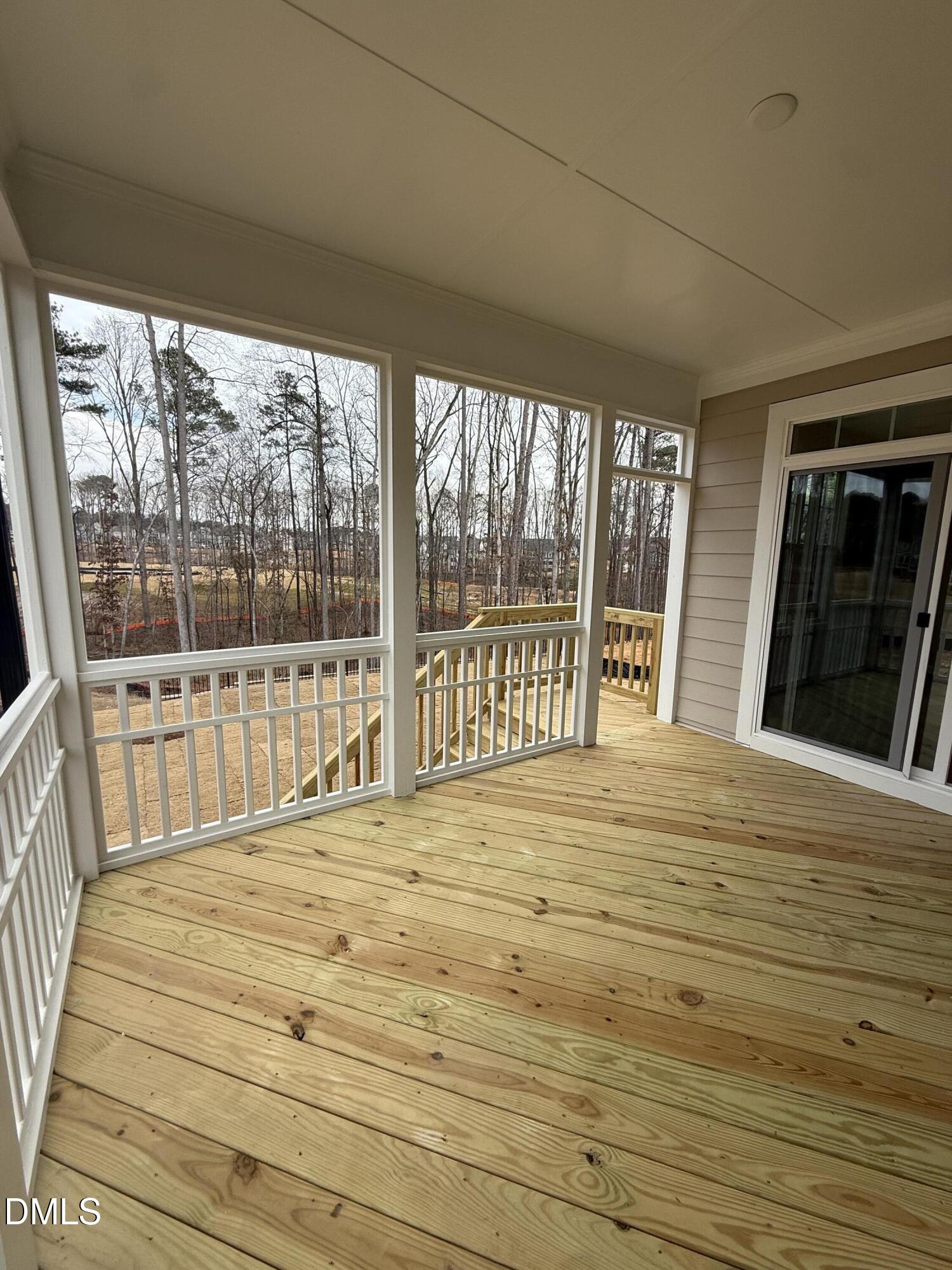 2437 Picual Way Apex, NC 27502 - Photo 8 of 31 a bedroom with a bed and wooden floor