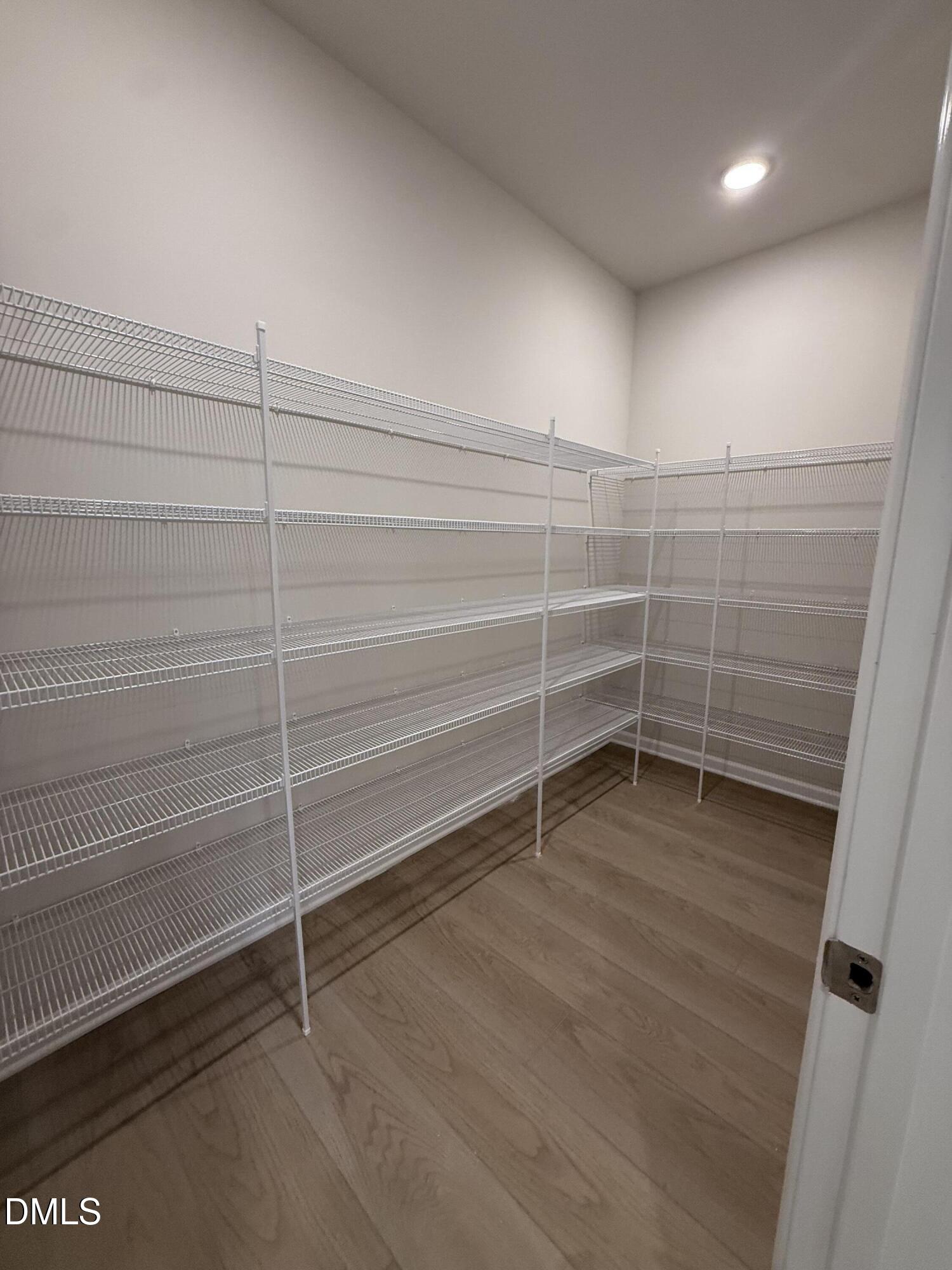 2437 Picual Way Apex, NC 27502 - Photo 10 of 31 a view of a room with shelves