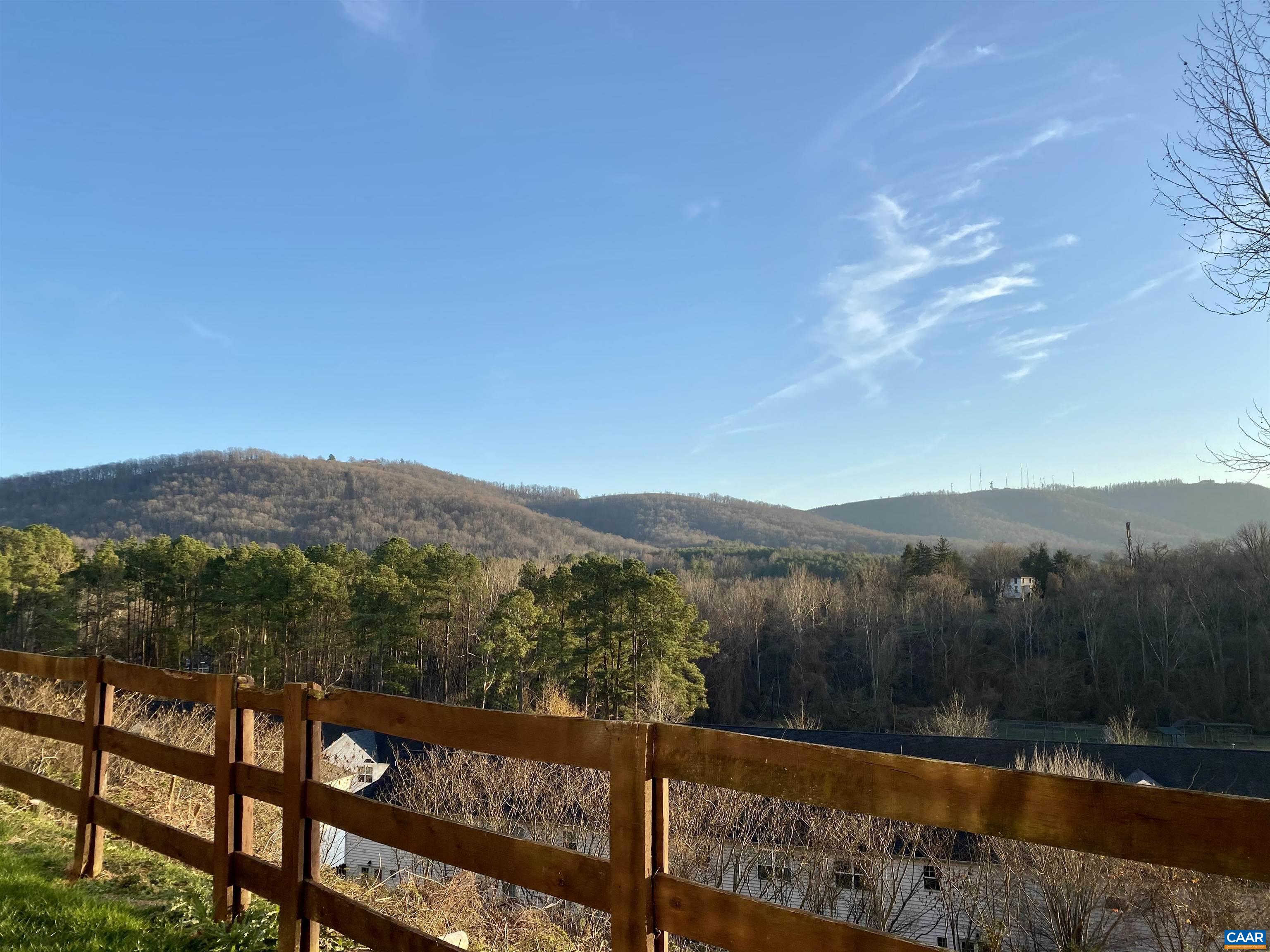 1608 A Monticello Avenue Charlottesville, VA 22902 - Photo 2 of 16 a view of a lake with a mountain in the background