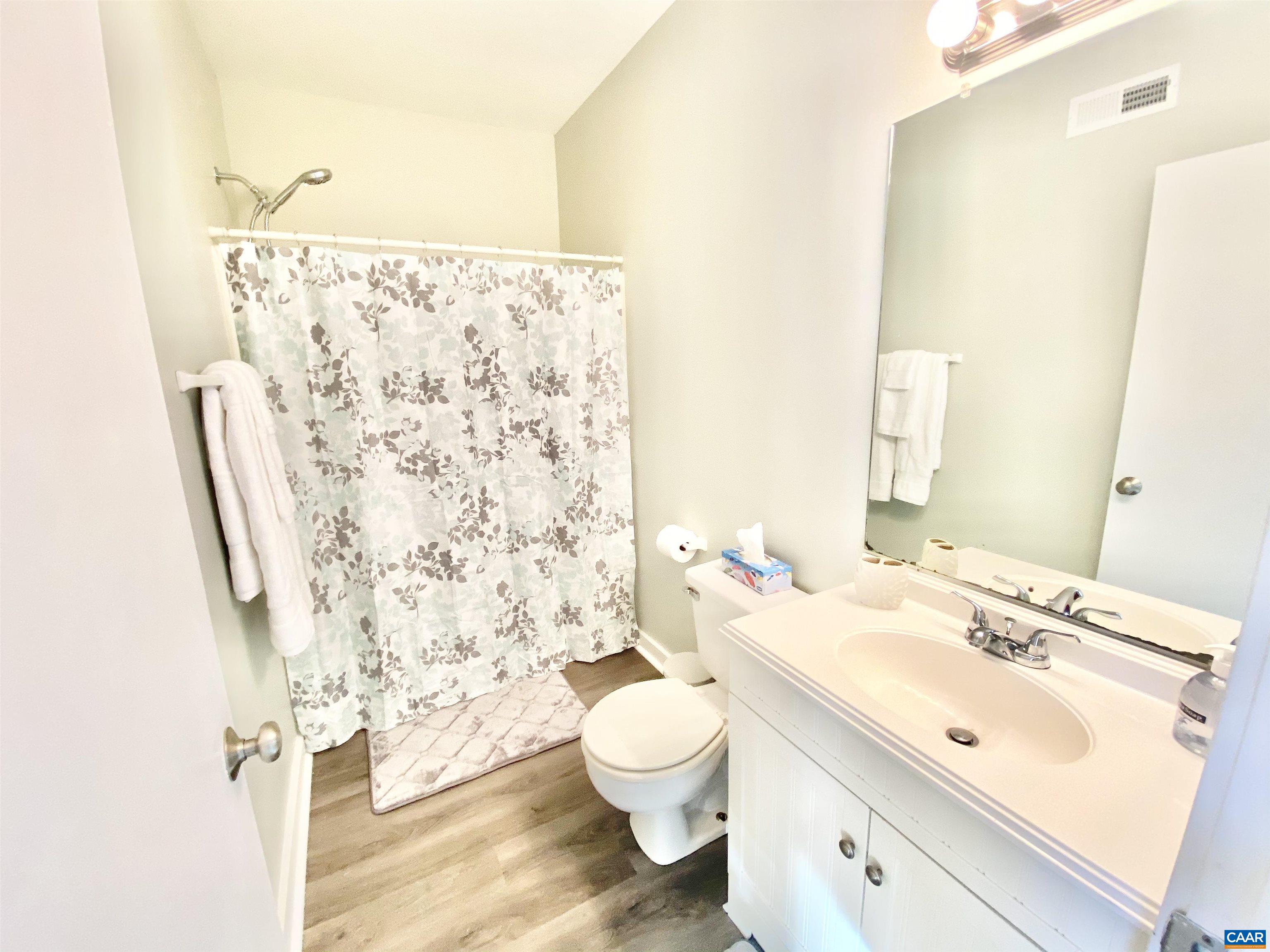 1608 A Monticello Avenue Charlottesville, VA 22902 - Photo 6 of 16 a bathroom with a sink toilet and shower