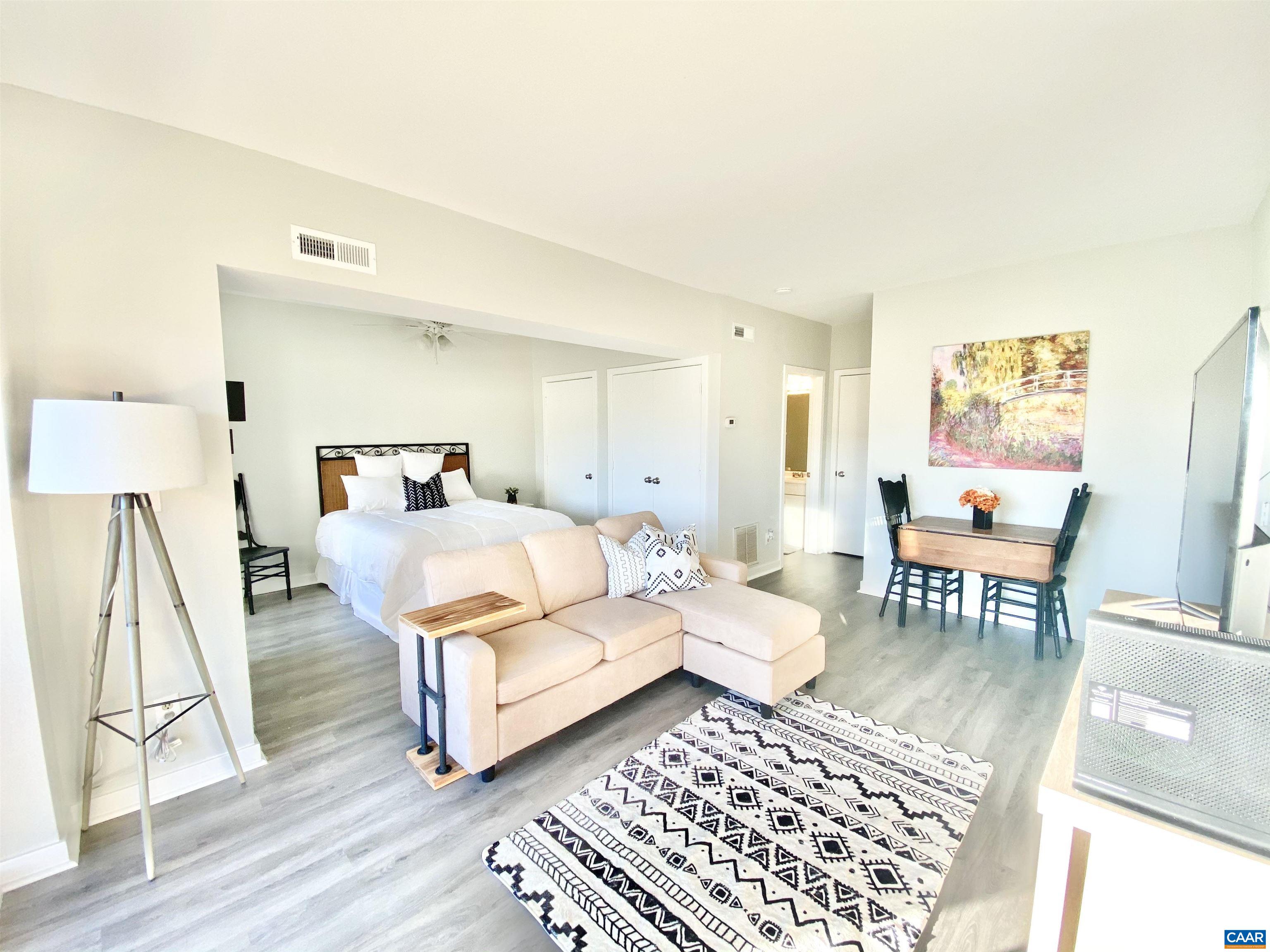 1608 A Monticello Avenue Charlottesville, VA 22902 - Photo 10 of 16 a bedroom with furniture and a rug