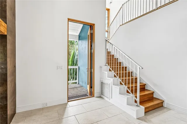 a view of entryway and hall with a front door