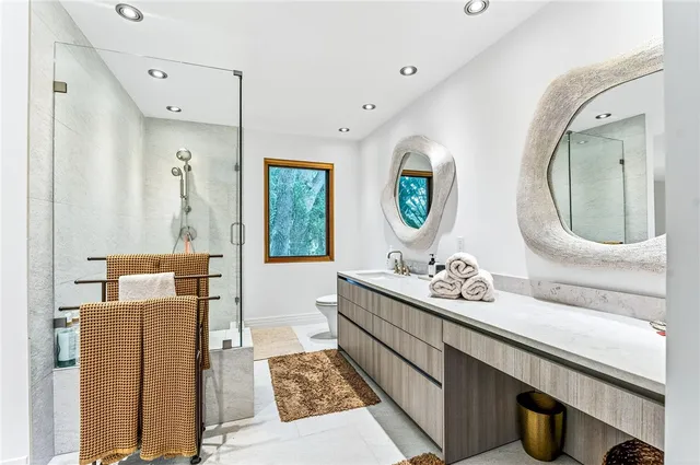 a bathroom with a double vanity sink and a mirror