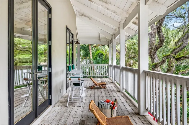 a view from deck with patio