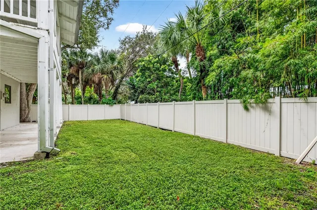 a view of backyard with small cabin