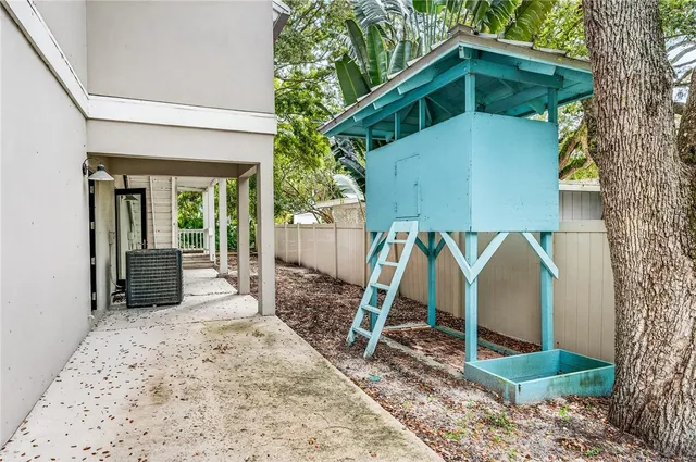 a house view with a backyard space