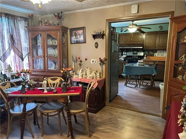 a view of a dining room with furniture and chandelier