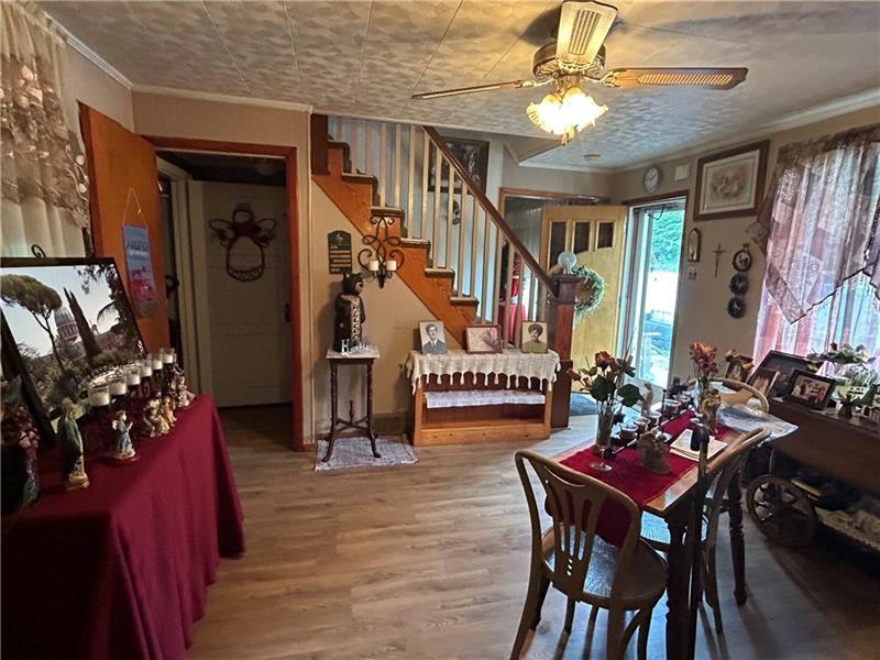 42 Walnut Avenue Dunbar, PA 15431 - Photo 12 of 31 a view of a dining room with furniture and a chandelier