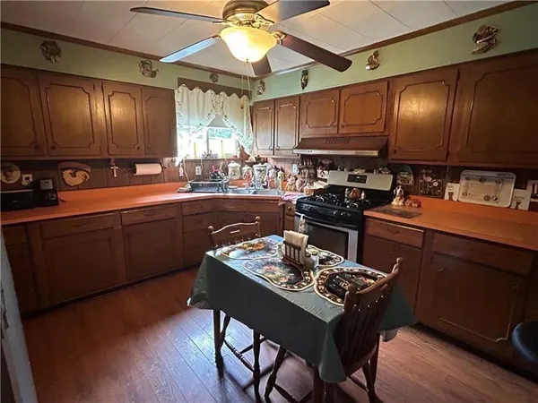 a kitchen with a table and chairs in it