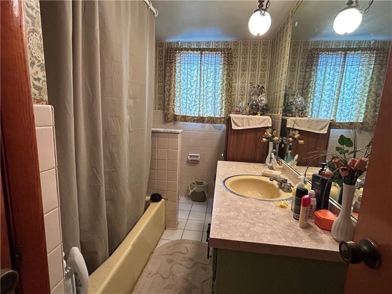 42 Walnut Avenue Dunbar, PA 15431 - Photo 19 of 31 a bathroom with a sink double vanity granite and a mirror