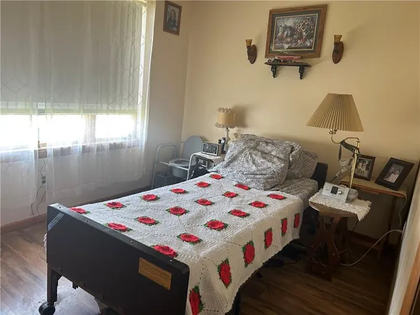 a bedroom with a bed and a table in it