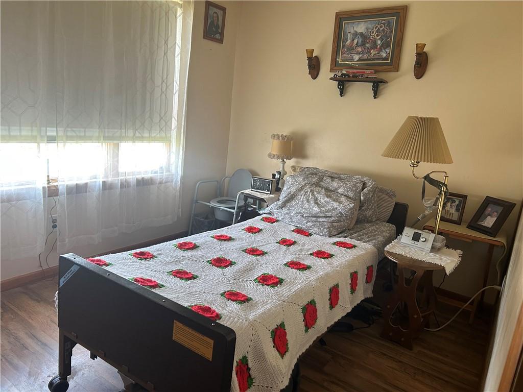 42 Walnut Avenue Dunbar, PA 15431 - Photo 10 of 31 a bedroom with a bed and a table in it