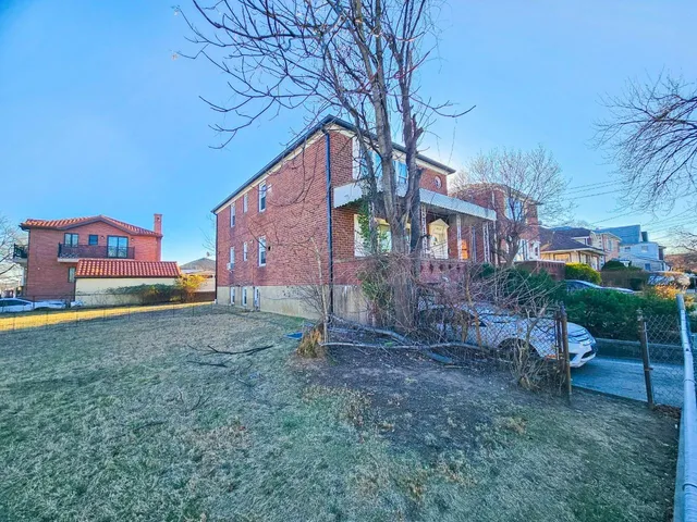 a backyard of a house with seating space