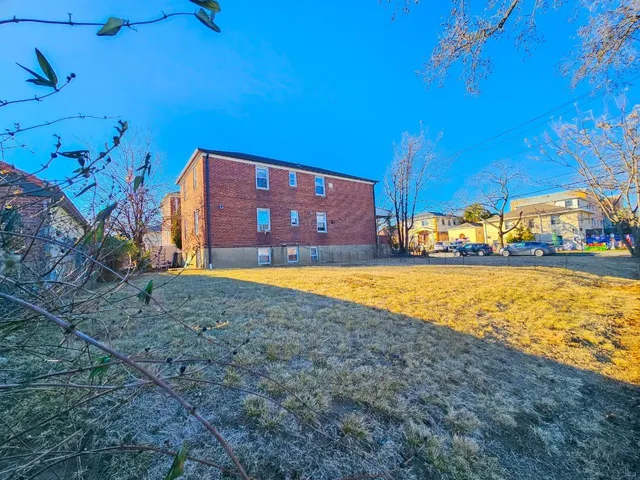 a view of a swimming pool with an outdoor space and seating area