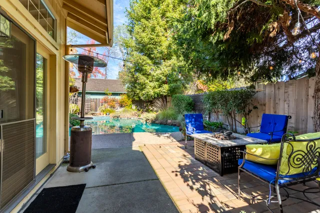 a view of a chairs and table in the patio