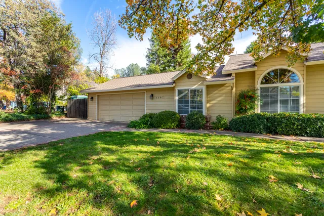 a front view of a house with a garden