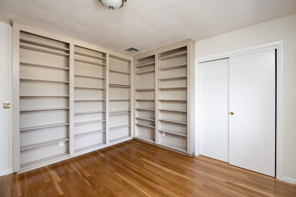 535 Clinton Road Brookline, MA 02467 - Photo 10 of 12 a view of walk in closet with empty racks
