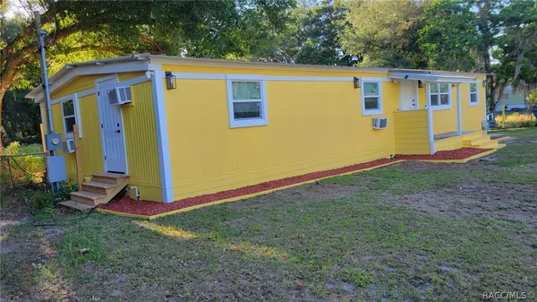 a view of a backyard with a small cabin