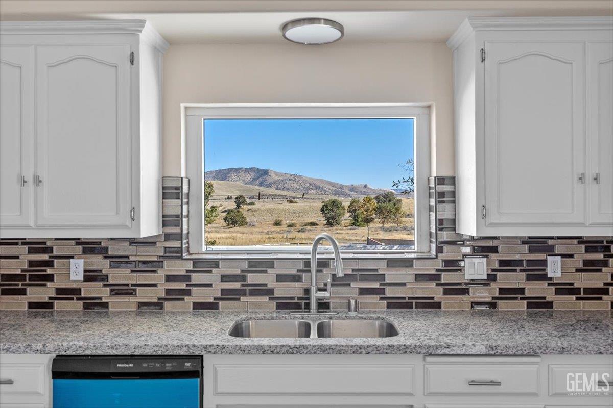 Undisclosed Address Tehachapi, CA 93561 - Photo 14 of 40 a kitchen with granite countertop a sink and a counter top space