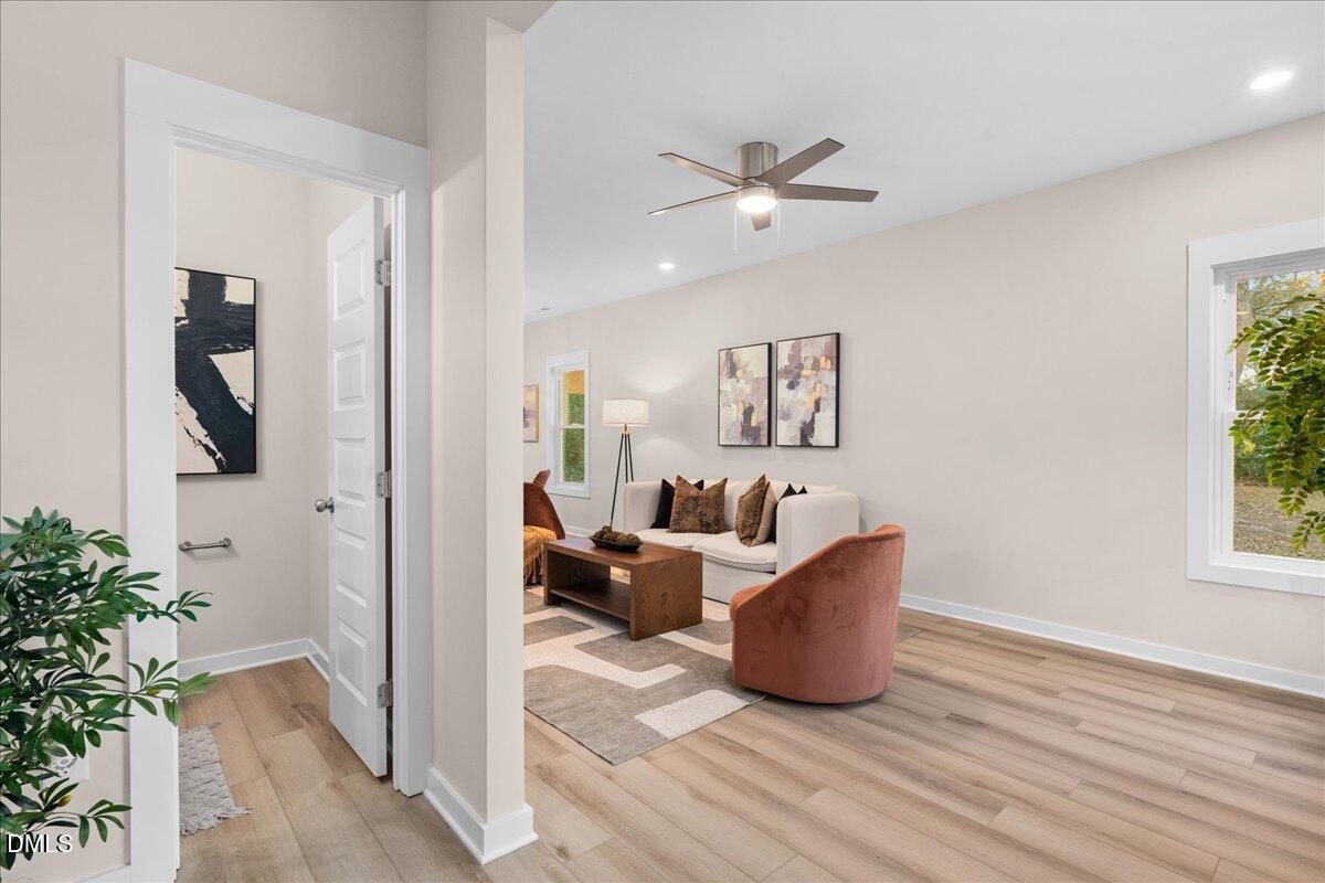 1917 Essex Road, Unit A Durham, NC 27704 - Photo 3 of 26 a living room with furniture and a potted plant