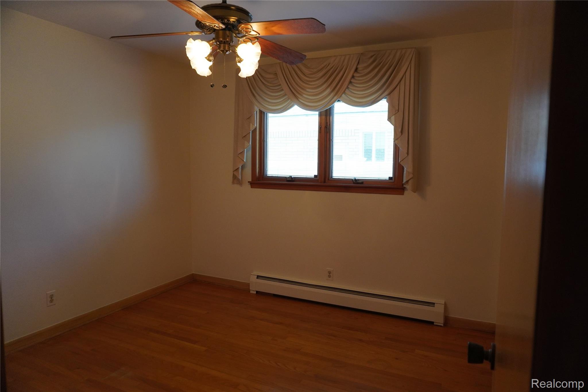 8115 Busch Street Center Line, MI 48015 - Photo 18 of 19 Bedroom with Hardwood floors, freshly painted with Pella Window