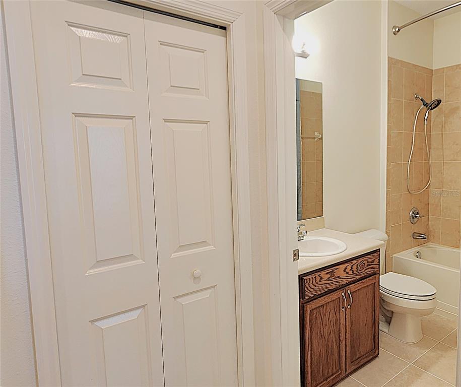 1636 West Caroline Path Lecanto, FL 34461 - Photo 19 of 85 a bathroom with a granite countertop sink a toilet and a shower