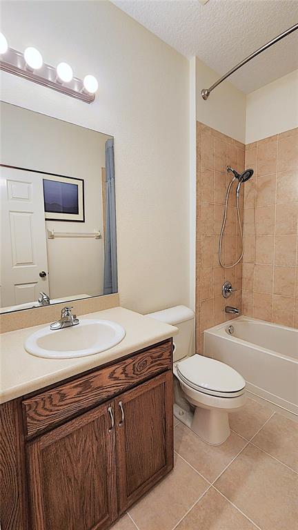 1636 West Caroline Path Lecanto, FL 34461 - Photo 20 of 85 a bathroom with a double vanity sink toilet mirror and shower