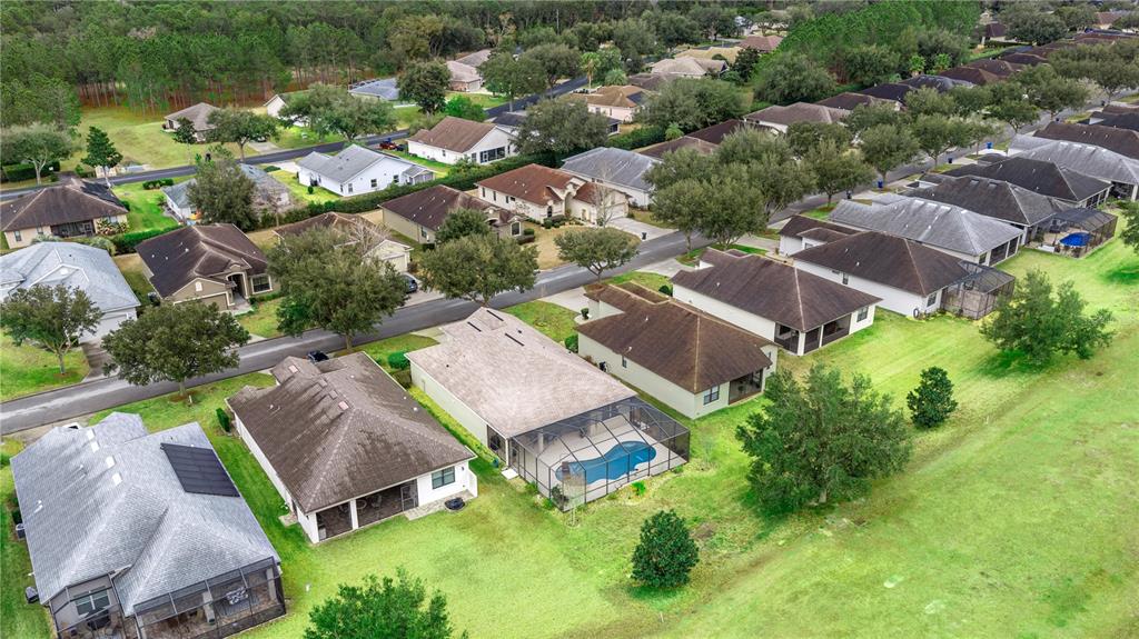 1636 West Caroline Path Lecanto, FL 34461 - Photo 2 of 85 an aerial view of multiple houses with yard