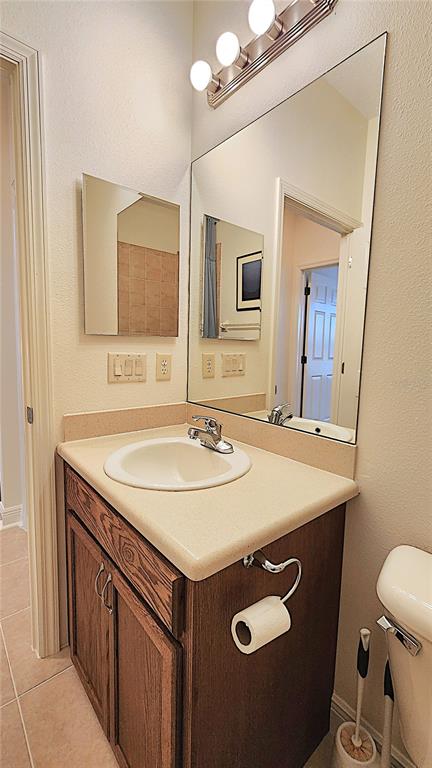 1636 West Caroline Path Lecanto, FL 34461 - Photo 22 of 85 a bathroom with a sink a mirror and a toilet