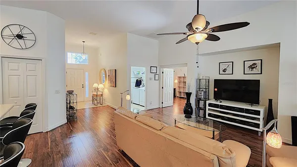 a view of a dining room with furniture window and wooden floor