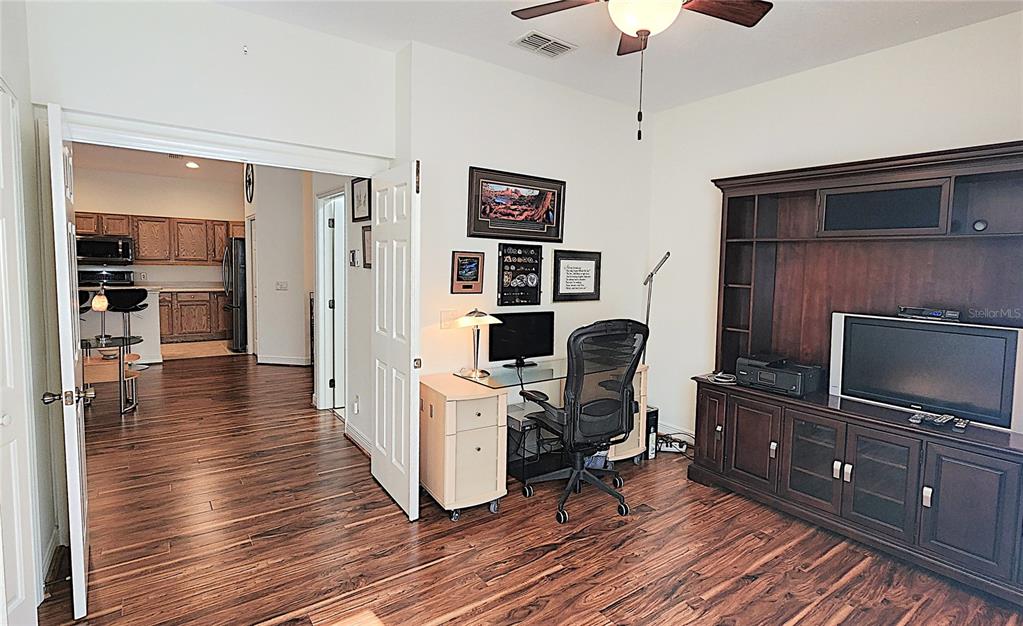 1636 West Caroline Path Lecanto, FL 34461 - Photo 35 of 85 a view of a workspace with wooden floor and furniture