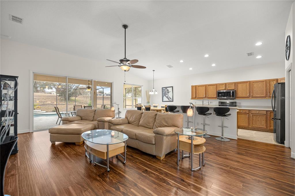 1636 West Caroline Path Lecanto, FL 34461 - Photo 36 of 85 a living room with furniture and a wooden floor