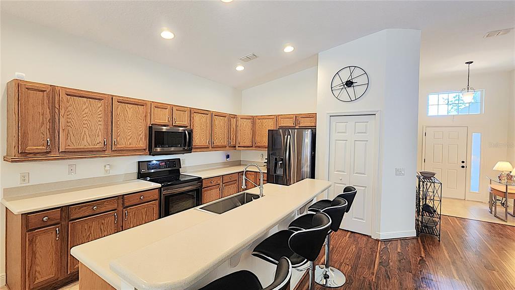 1636 West Caroline Path Lecanto, FL 34461 - Photo 39 of 85 a view of a kitchen with cabinets and wooden floor