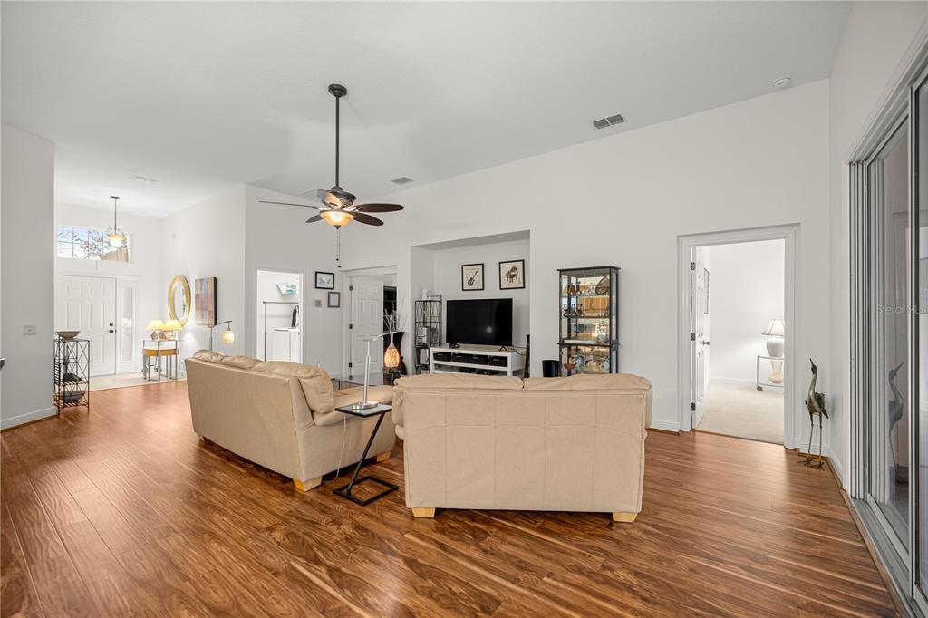 1636 West Caroline Path Lecanto, FL 34461 - Photo 50 of 85 a living room with fireplace furniture and a wooden floor