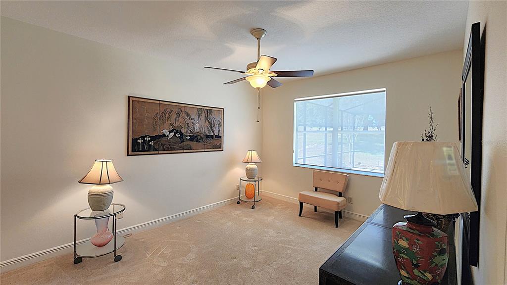 1636 West Caroline Path Lecanto, FL 34461 - Photo 52 of 85 a living room with furniture and a lamp