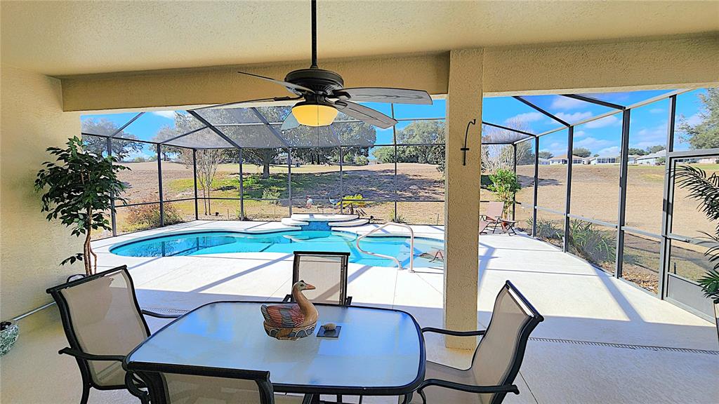 1636 West Caroline Path Lecanto, FL 34461 - Photo 67 of 85 a view of a dining room kitchen with a table and chairs