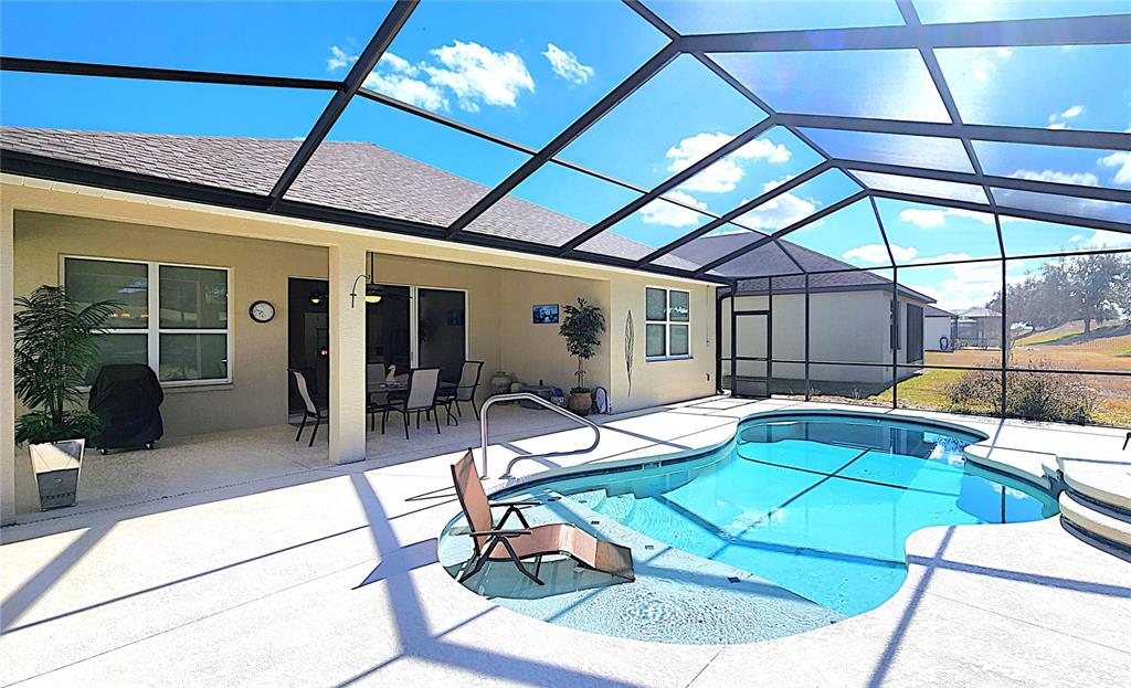 1636 West Caroline Path Lecanto, FL 34461 - Photo 72 of 85 a view of a swimming pool with a patio