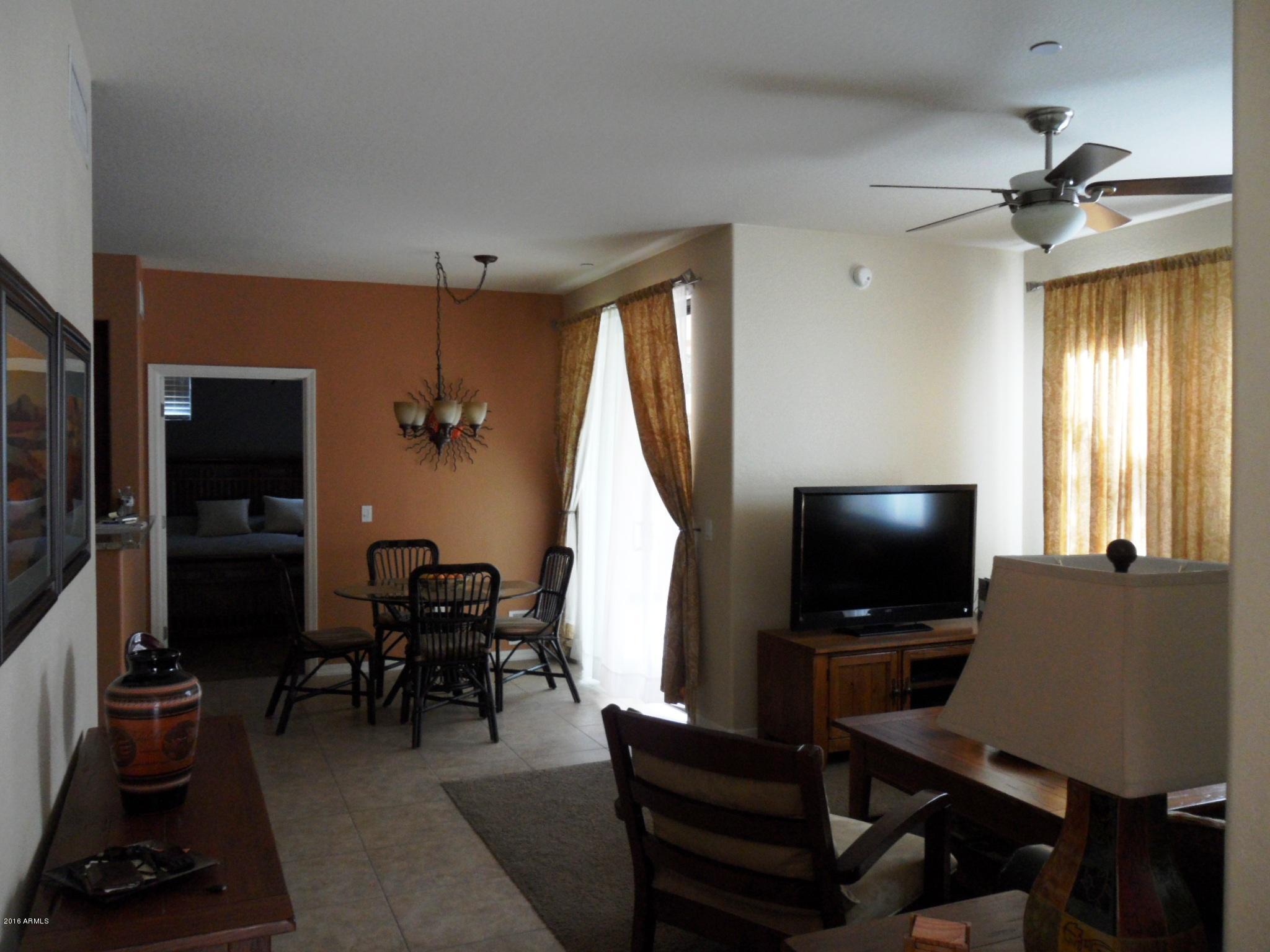 3330 South Gilbert Road, Unit 1015 Chandler, AZ 85286 - Photo 1 of 30 a view of a livingroom with furniture and a window
