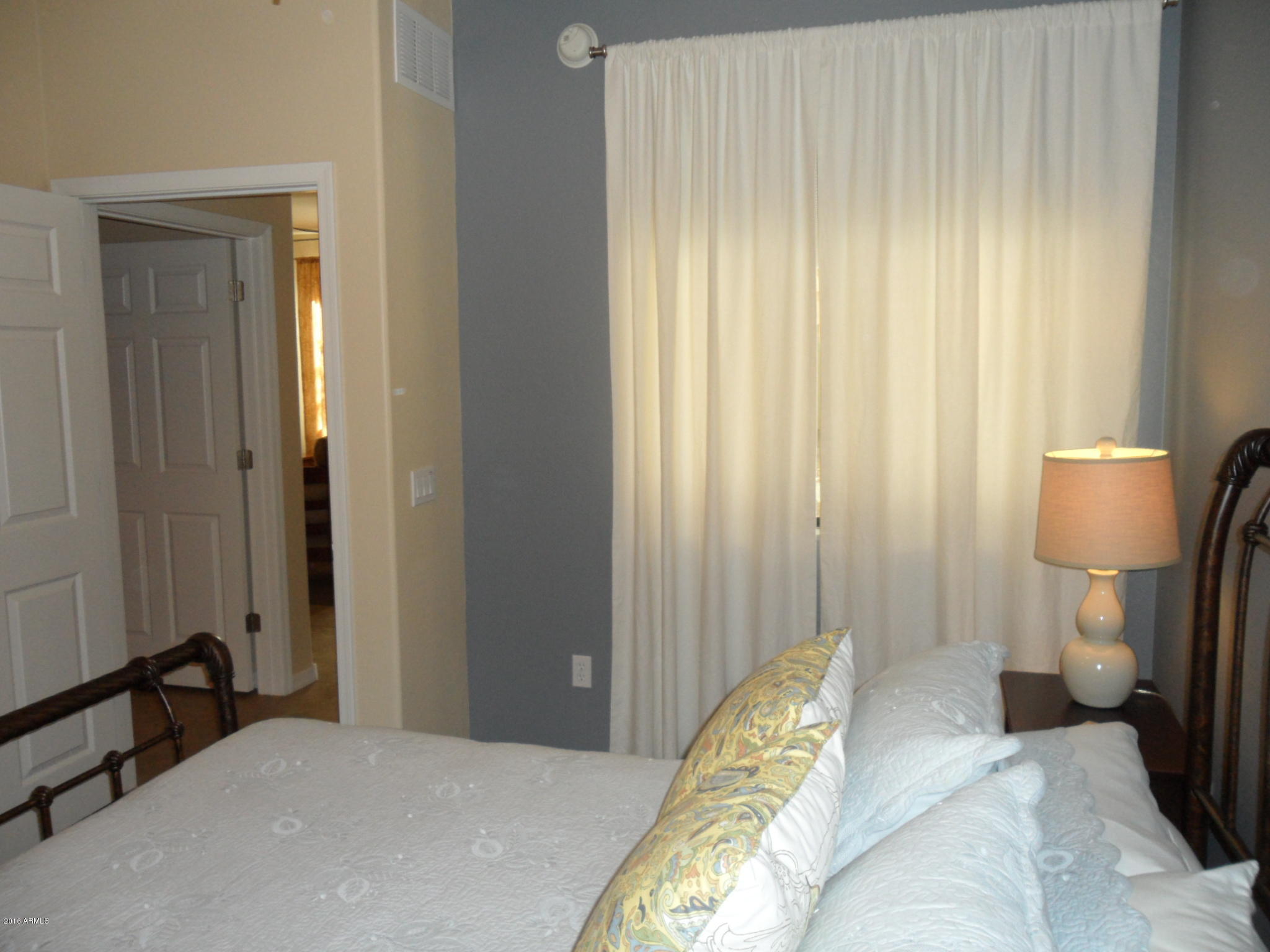 3330 South Gilbert Road, Unit 1015 Chandler, AZ 85286 - Photo 14 of 30 a bedroom with a bed and a window