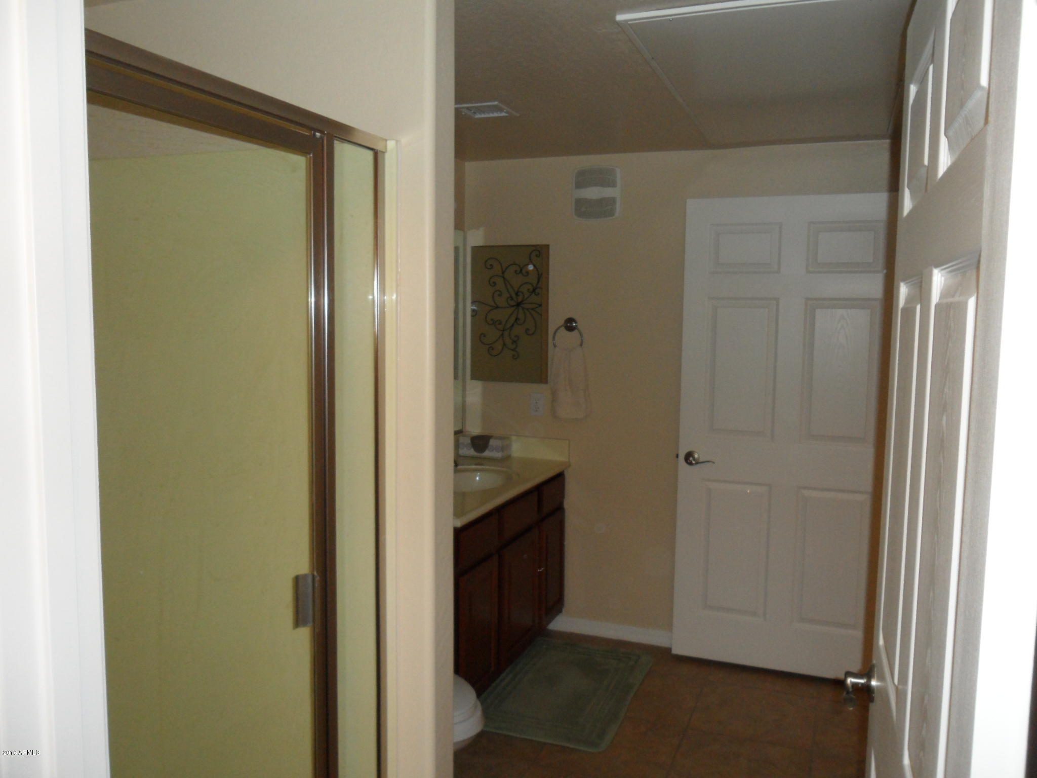 3330 South Gilbert Road, Unit 1015 Chandler, AZ 85286 - Photo 16 of 30 a bathroom with a granite countertop sink and a mirror