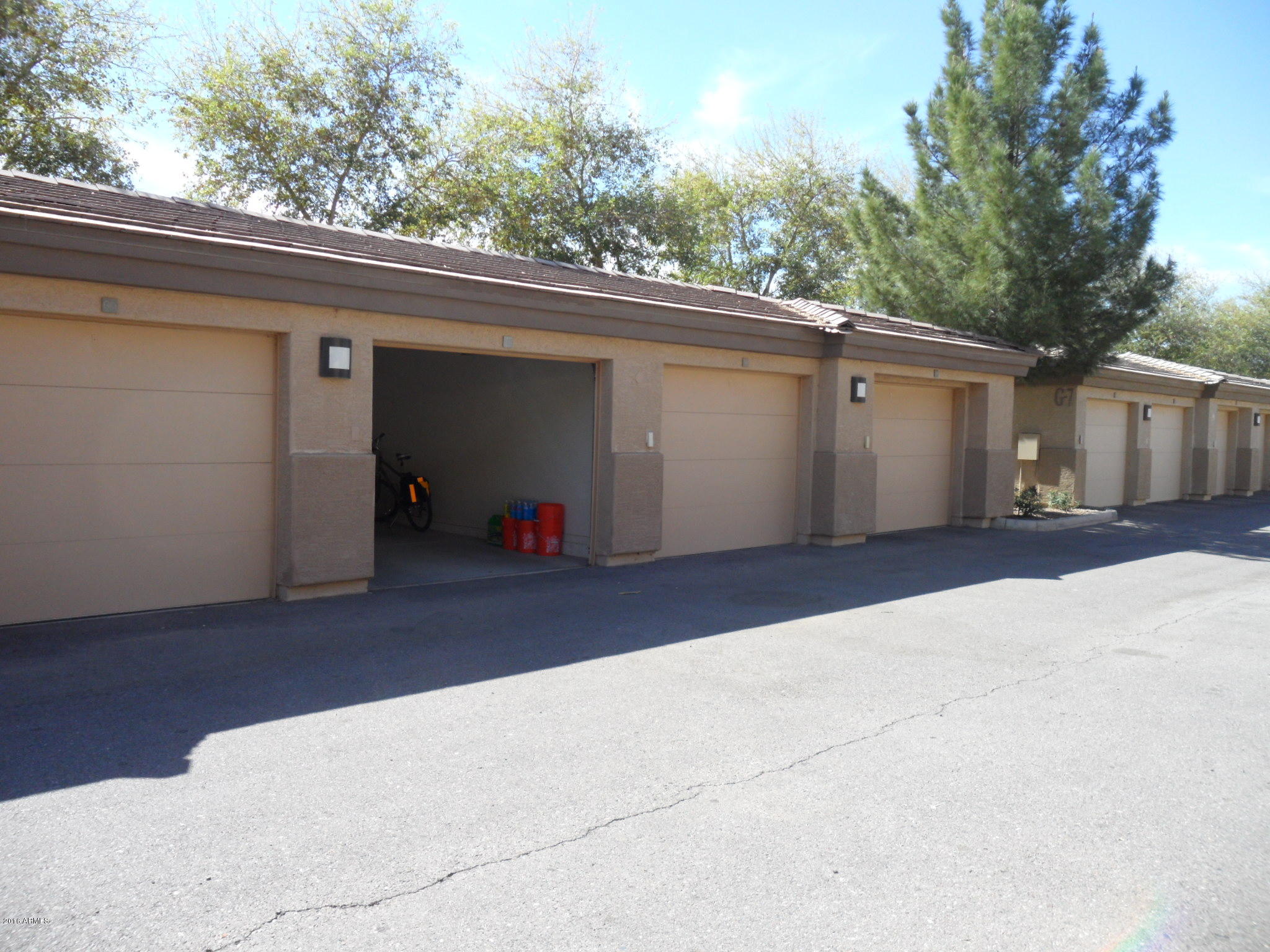 3330 South Gilbert Road, Unit 1015 Chandler, AZ 85286 - Photo 20 of 30 a side view of a house with a garage