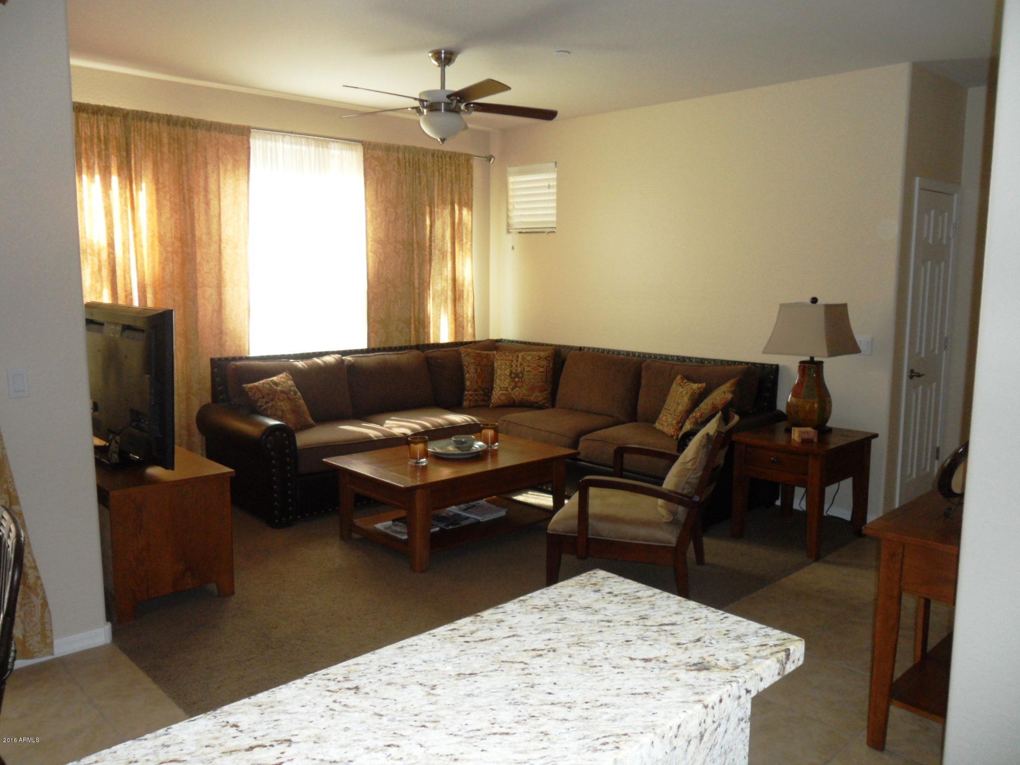3330 South Gilbert Road, Unit 1015 Chandler, AZ 85286 - Photo 2 of 30 a living room with furniture and a window
