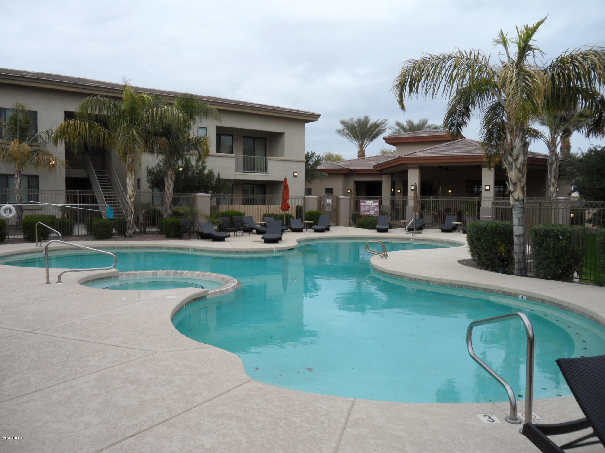 3330 South Gilbert Road, Unit 1015 Chandler, AZ 85286 - Photo 22 of 30 a view of a swimming pool with a patio