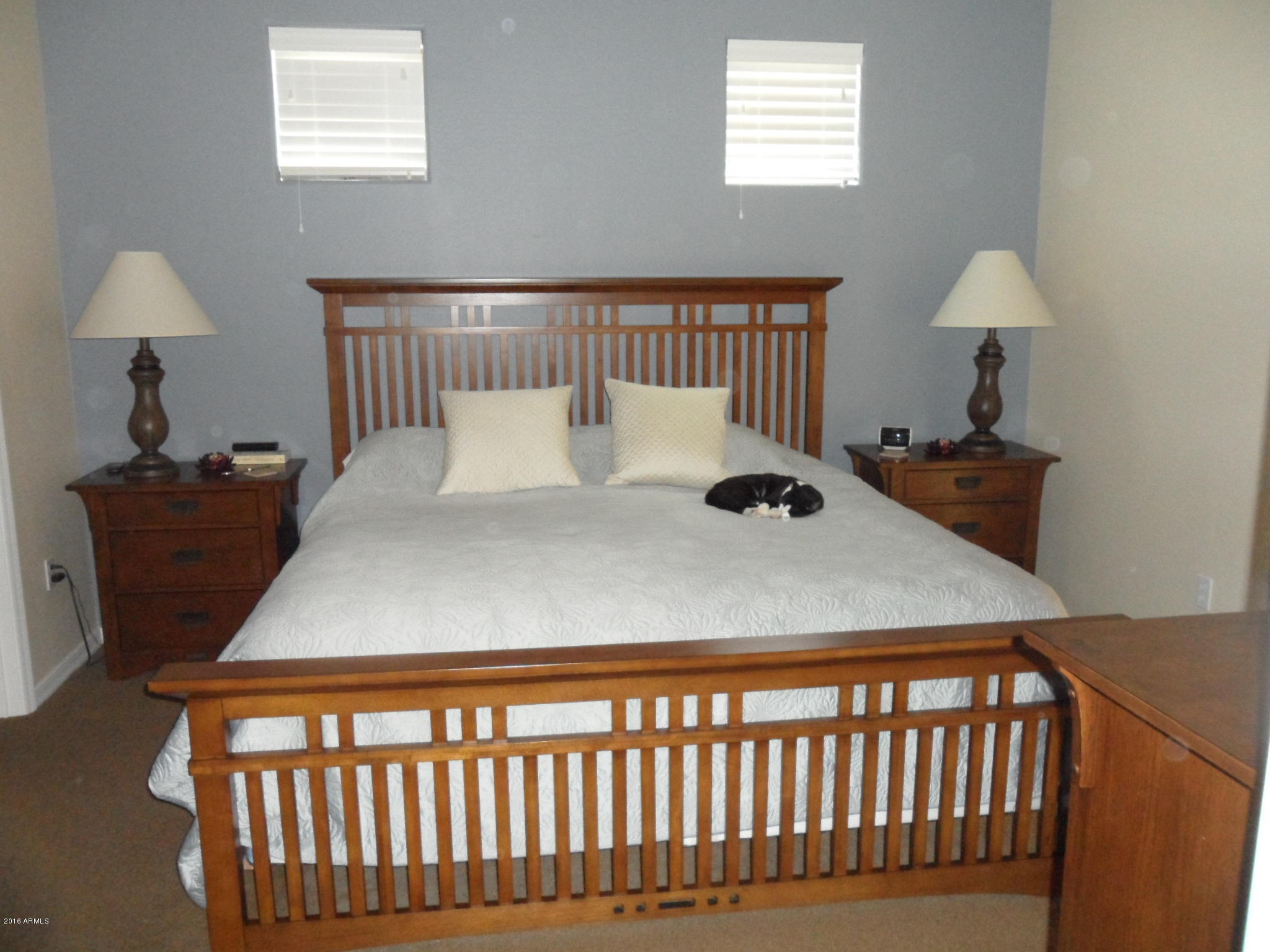 3330 South Gilbert Road, Unit 1015 Chandler, AZ 85286 - Photo 7 of 30 a bedroom with a bed and a table