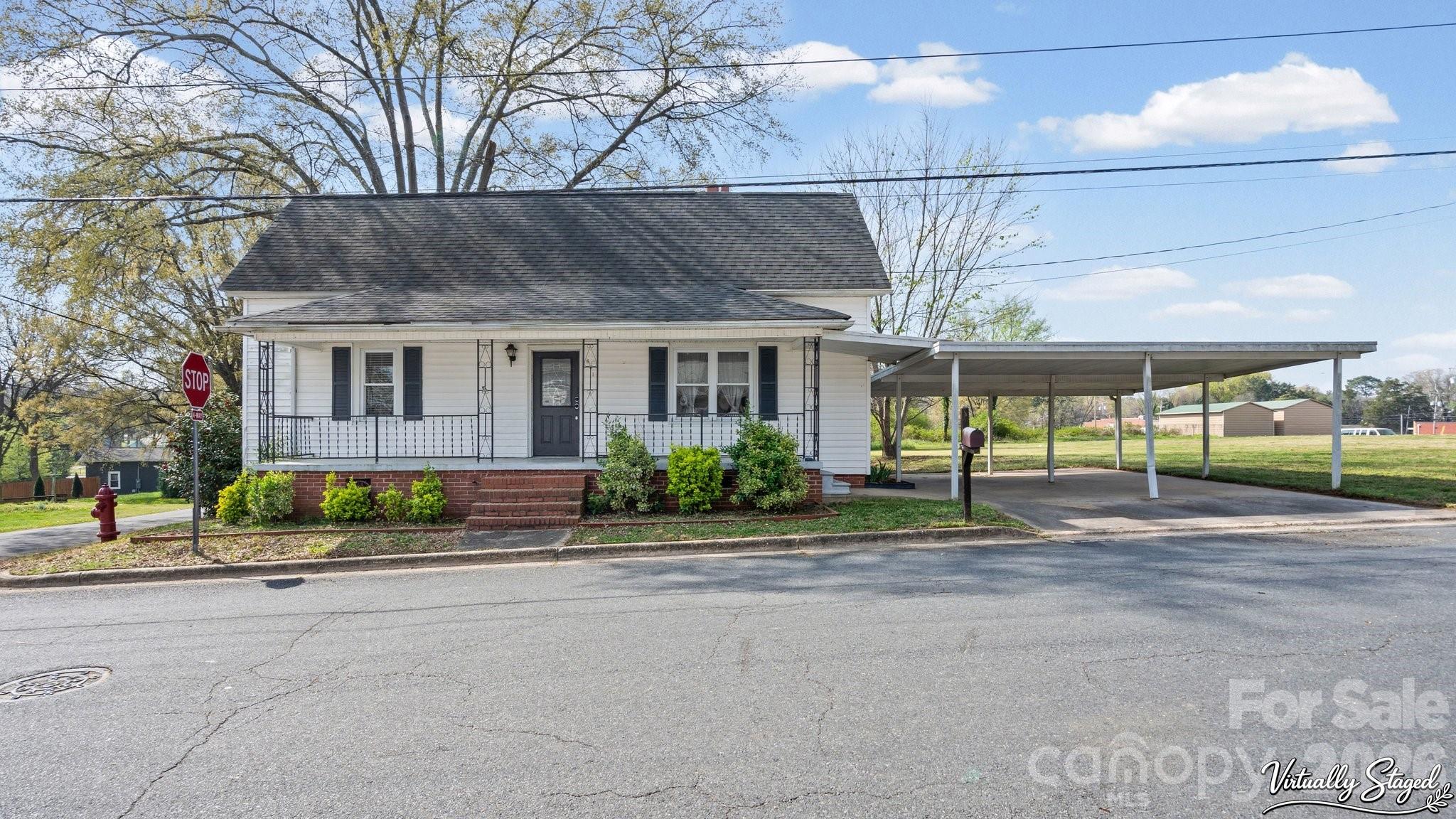 901 Mill Street Albemarle, NC 28001 - Photo 1 of 27 a view of a house next to a yard