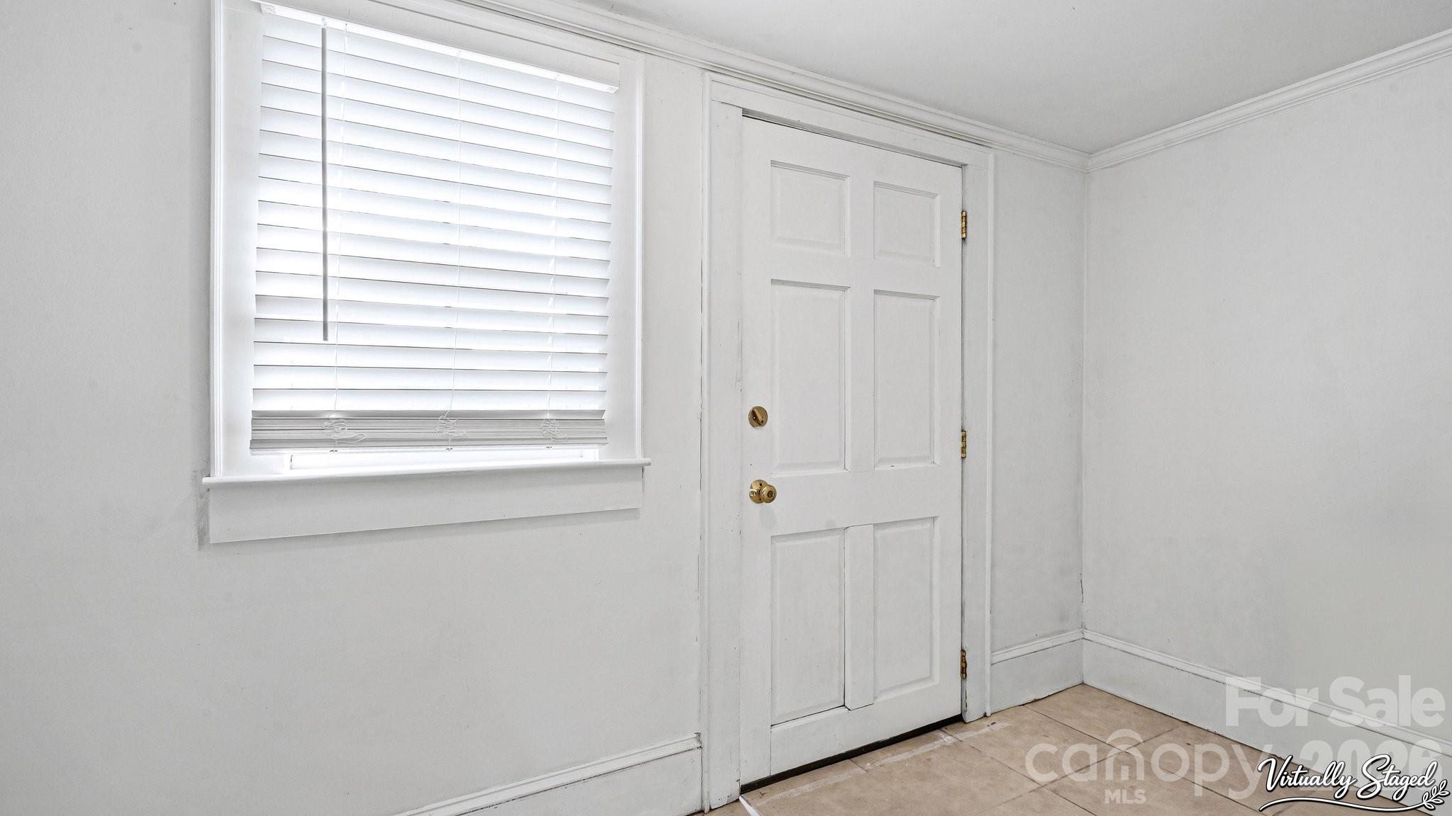 901 Mill Street Albemarle, NC 28001 - Photo 17 of 27 a view of a window in an empty room