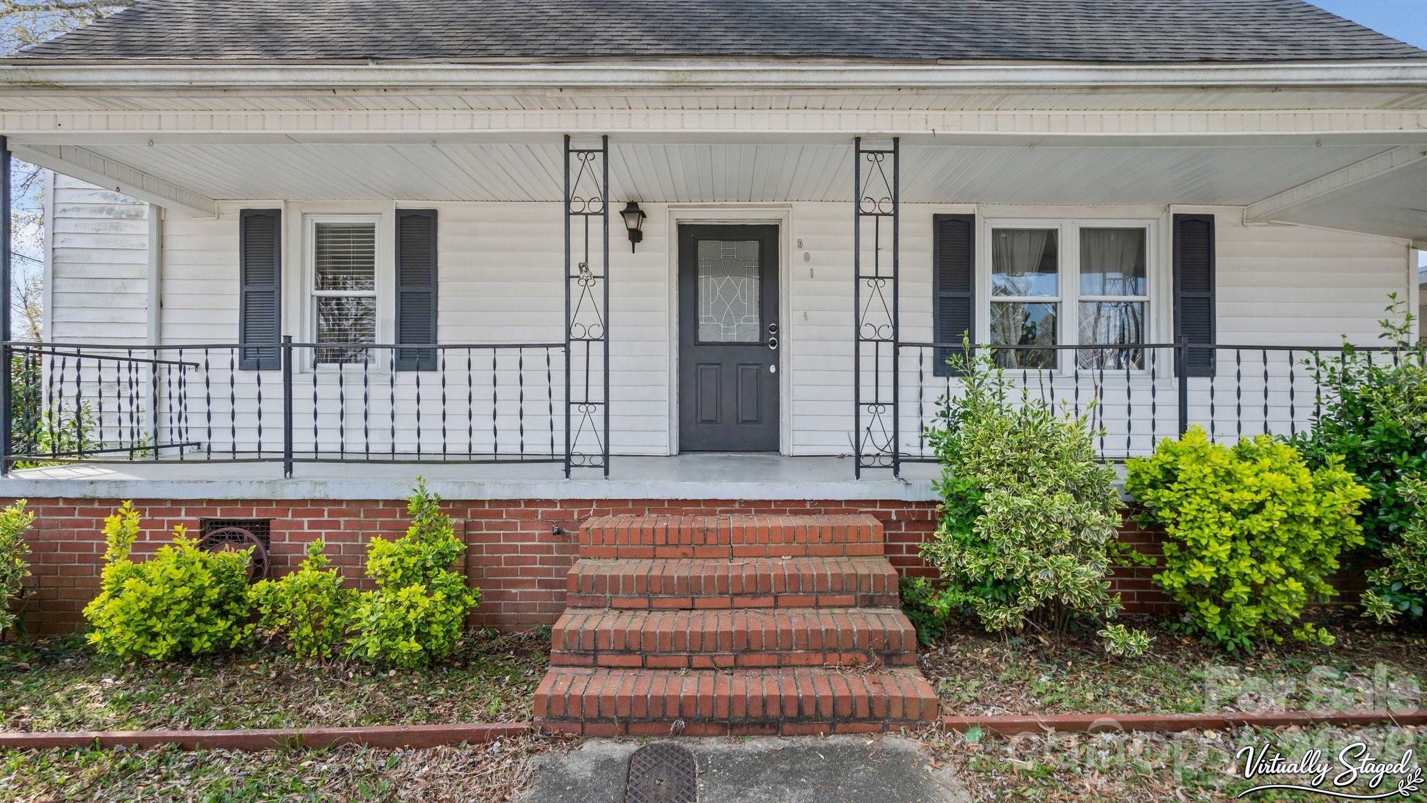 901 Mill Street Albemarle, NC 28001 - Photo 2 of 27 a front view of a house with a garden